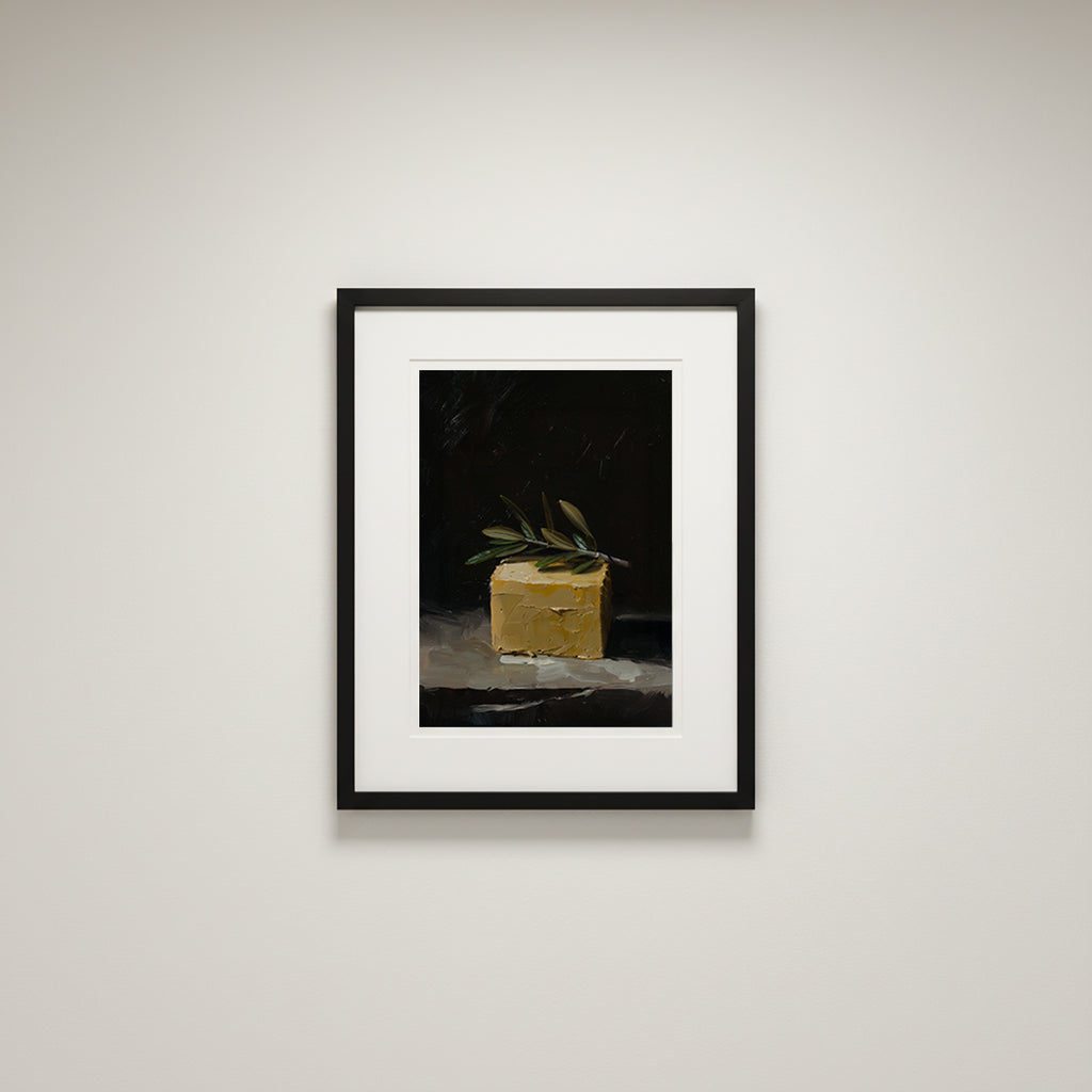 oil style still life painting of a butter block topped with an olive branch on a dark background, classical textured artwork with warm light