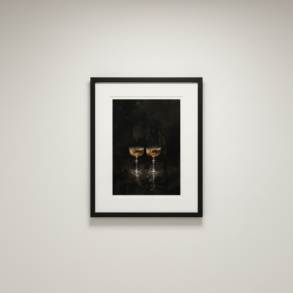 Framed artwork of two champagne glasses on a dark background, mounted on a light gray wall.