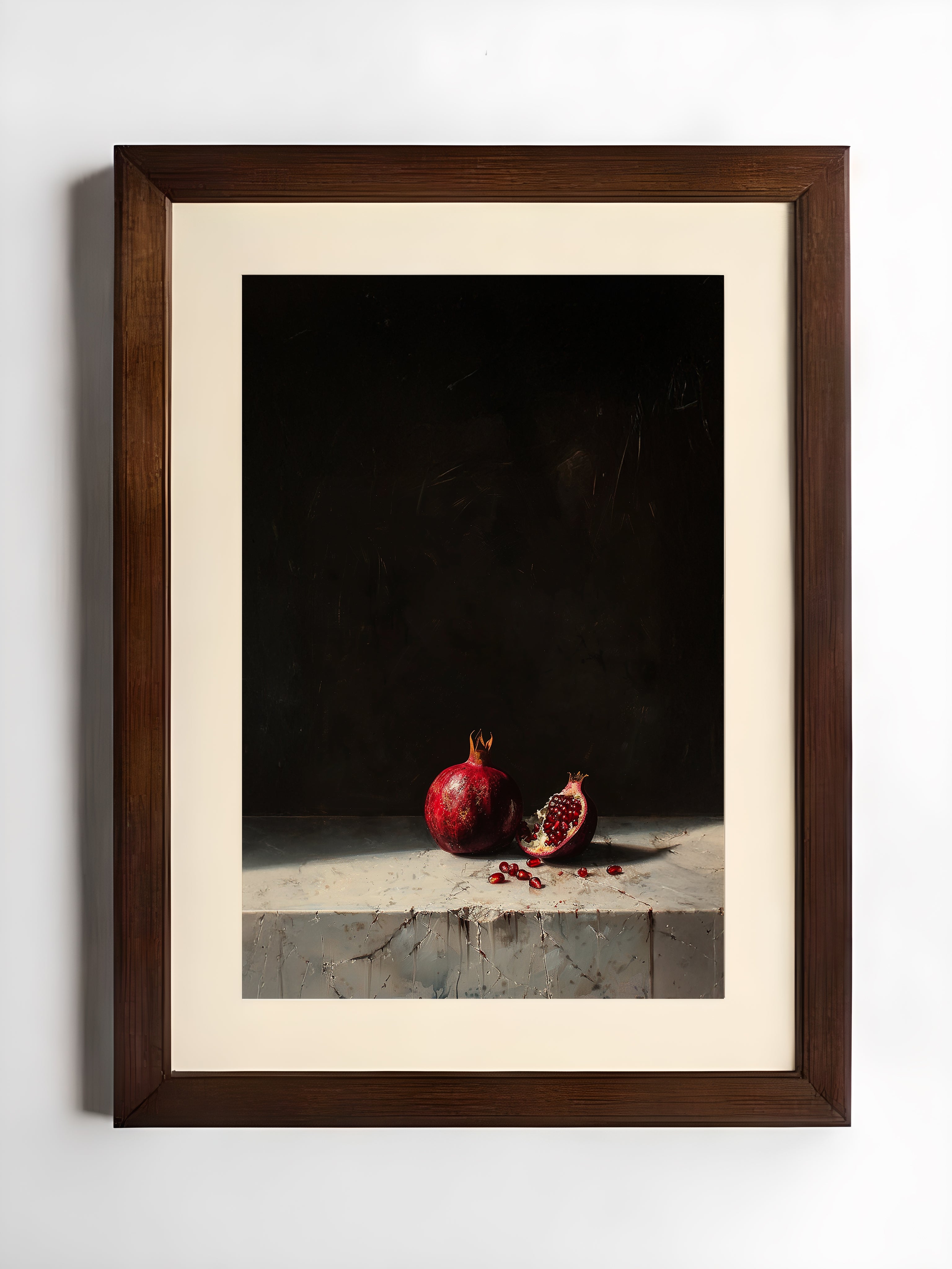 Framed still life photograph of pomegranates on a dark background