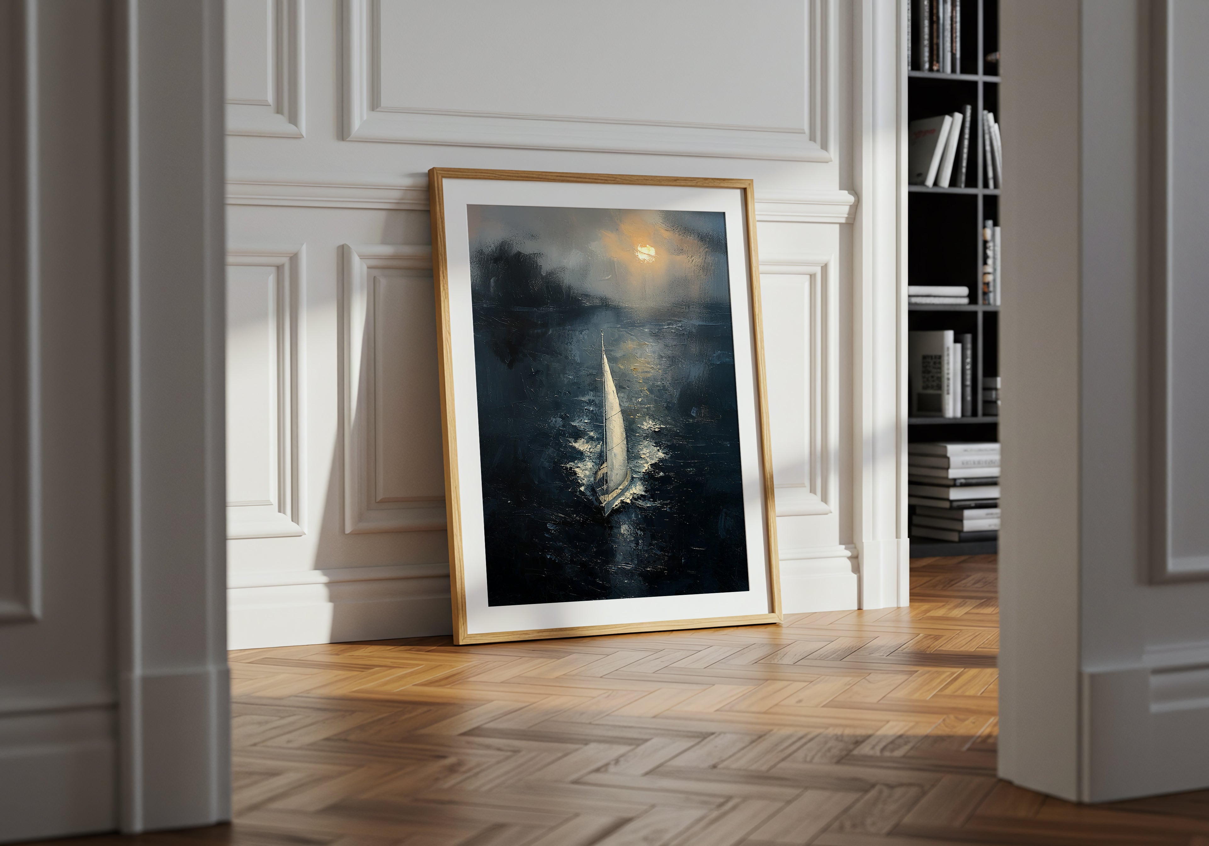 Fine art print of a solitary sailboat gliding across a dark, moody sea under a glowing horizon, framed in a black gallery frame with a white mat.