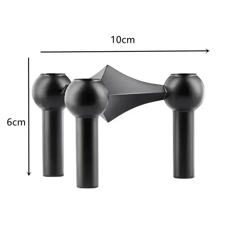 Black hair dryer nozzle with measurements on a white background