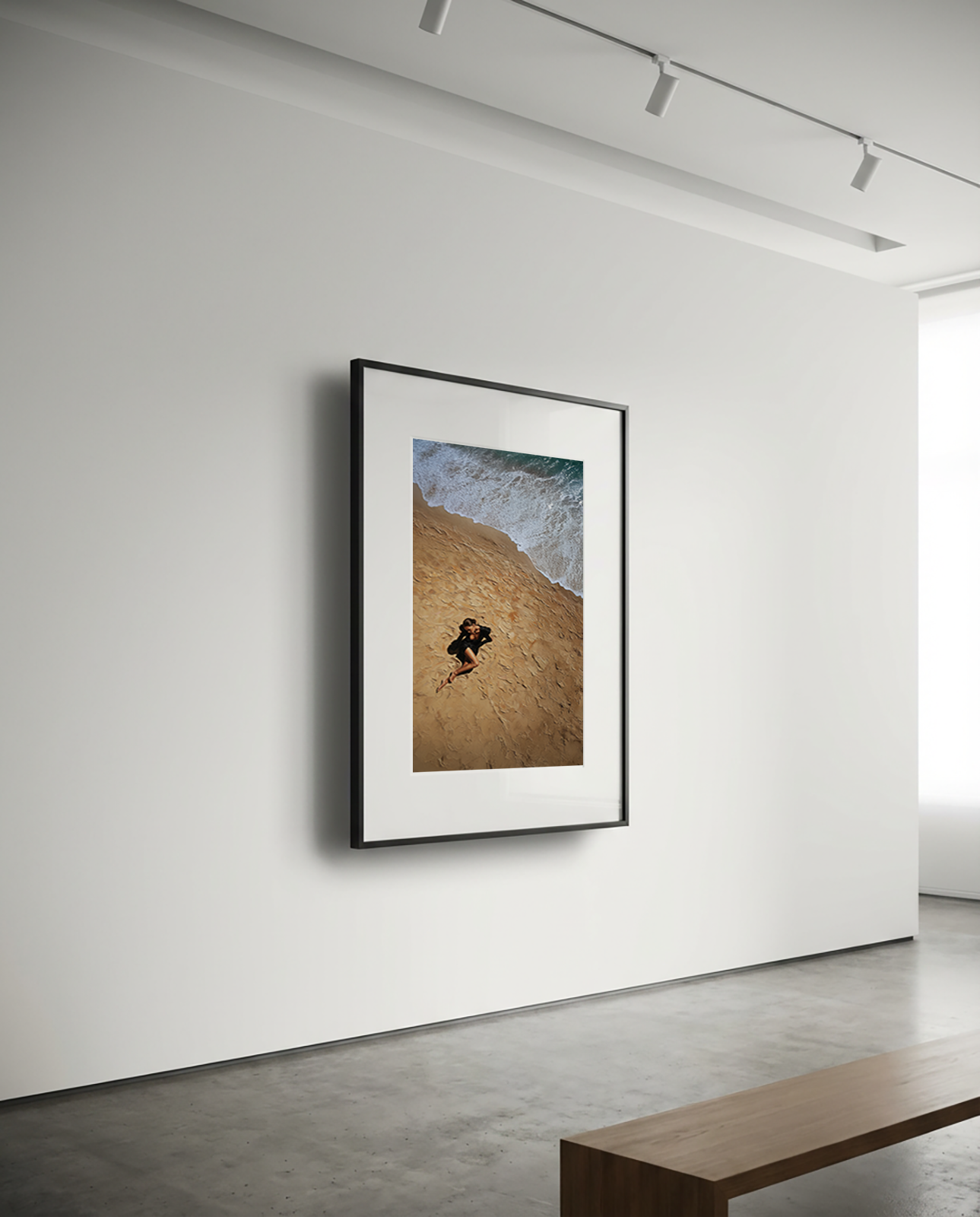 Framed artwork of a person running on a hill in a minimalistic room with a bench.