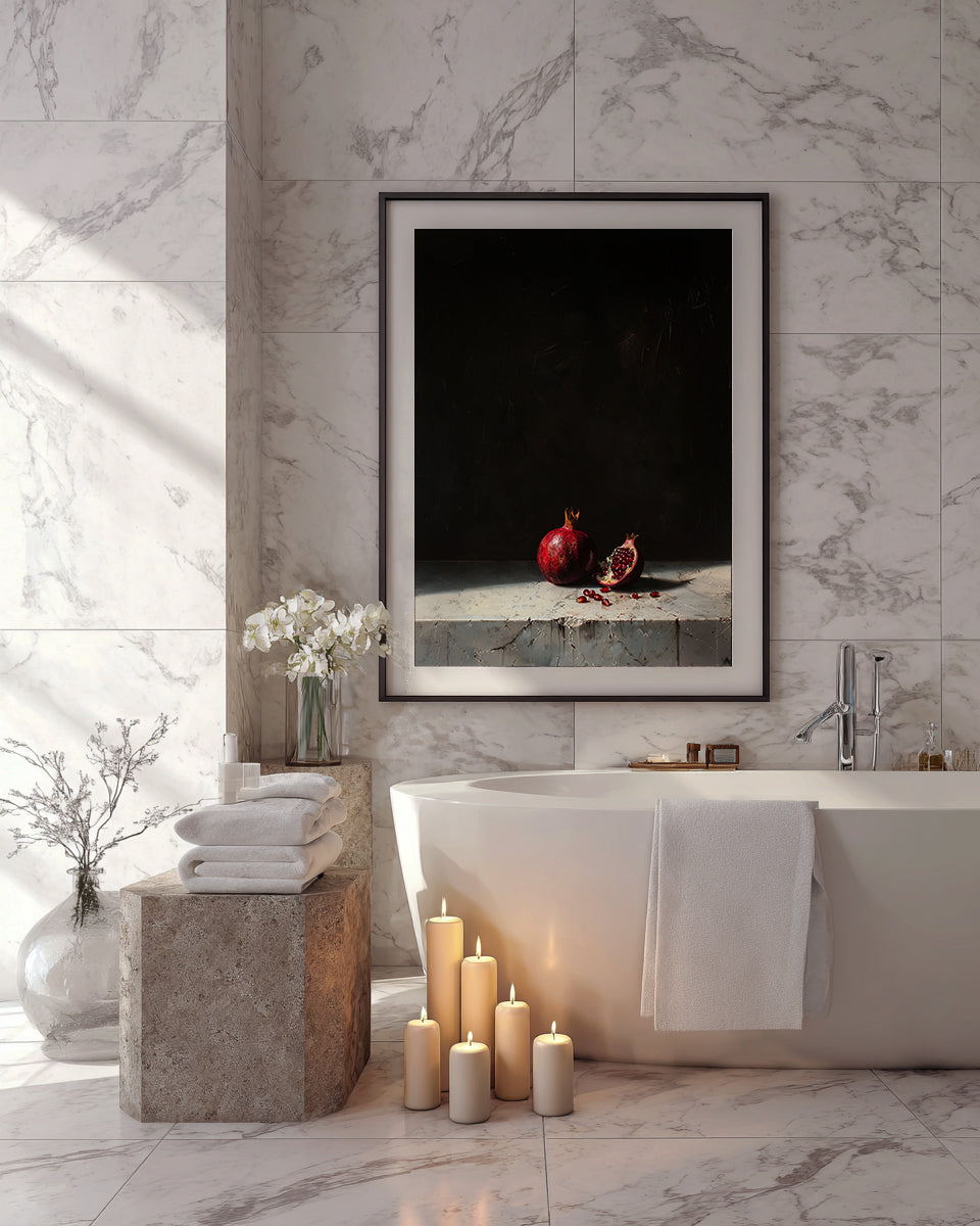 Bathroom interior with a framed artwork above a bathtub, candles on the floor, and towels.