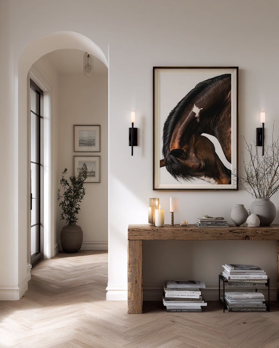 close up photograph of a horse lowering its head in a graceful bow, showing the curved neck and soft lighting
