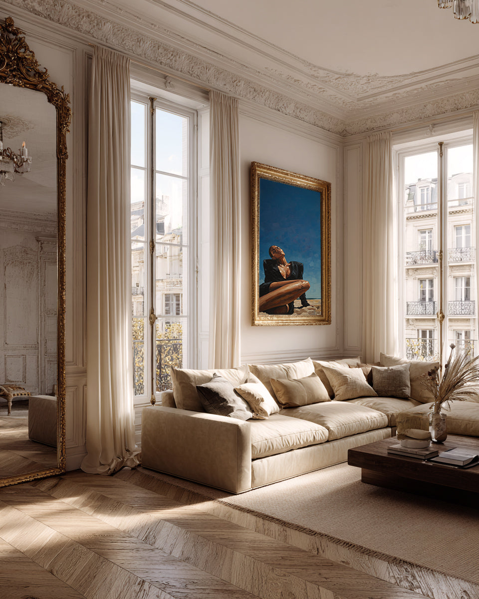 Luxurious living room with a large sofa, decorative mirror, and artwork.