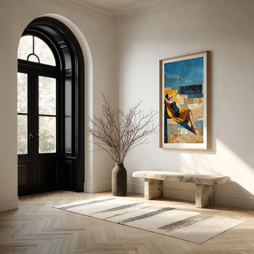 Modern interior with a black door, marble bench, and framed artwork on a white wall.
