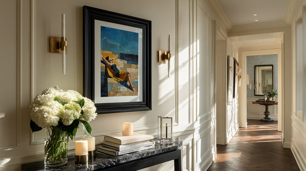 Elegant hallway with a framed abstract painting, candles, and flowers on a console table.
