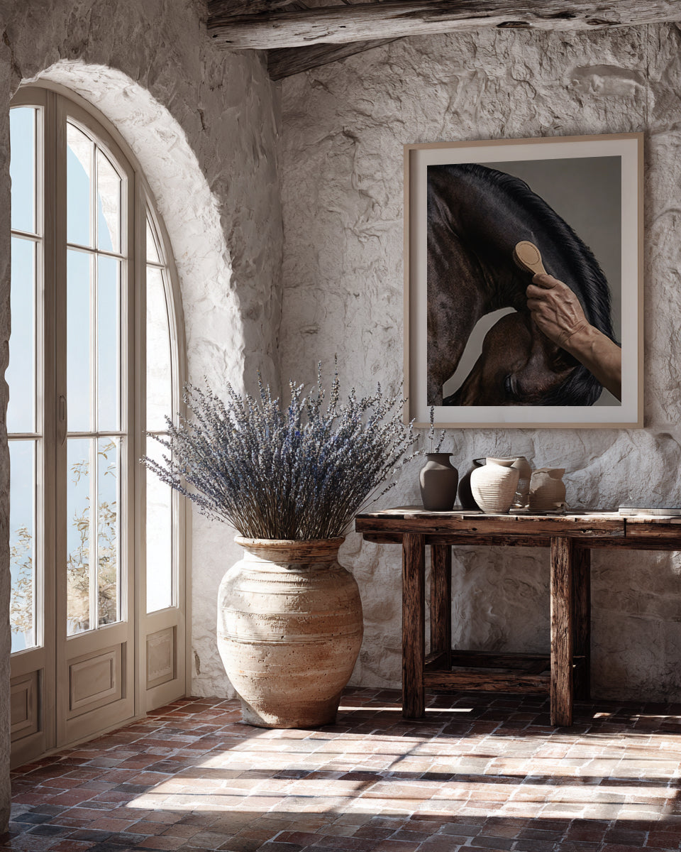 close up photograph of a horse’s crest being brushed by hand in soft studio lighting