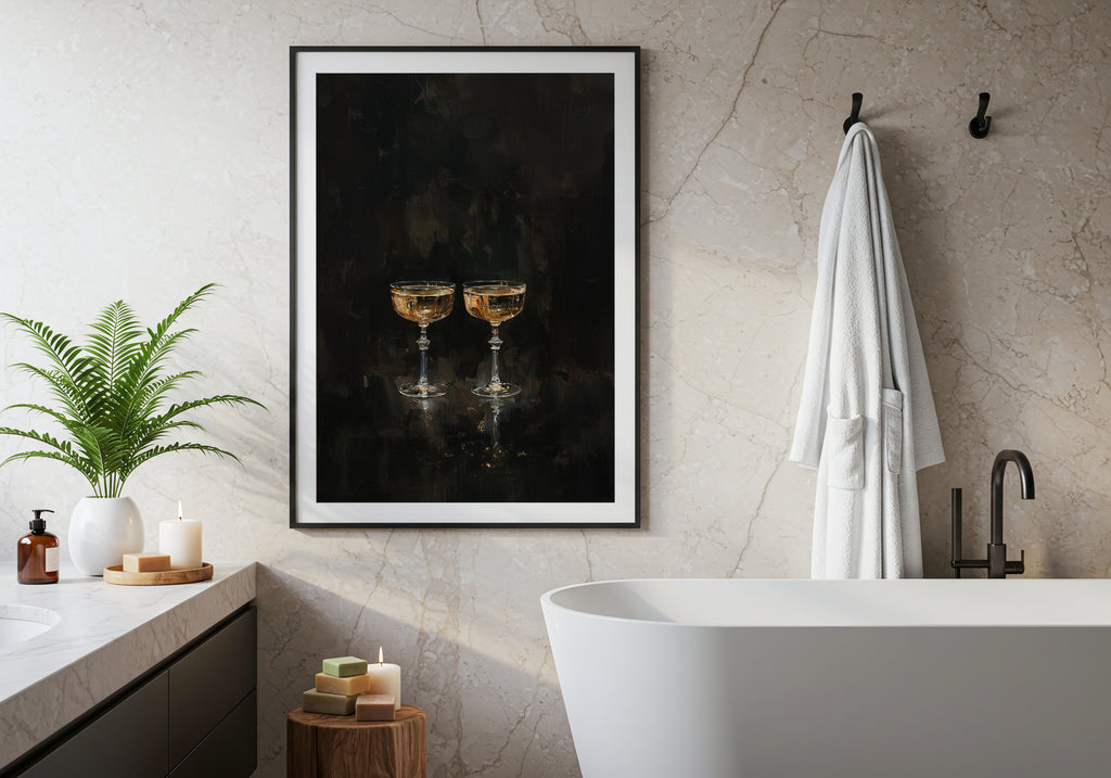 Bathroom interior with a framed artwork of two champagne glasses on the wall.